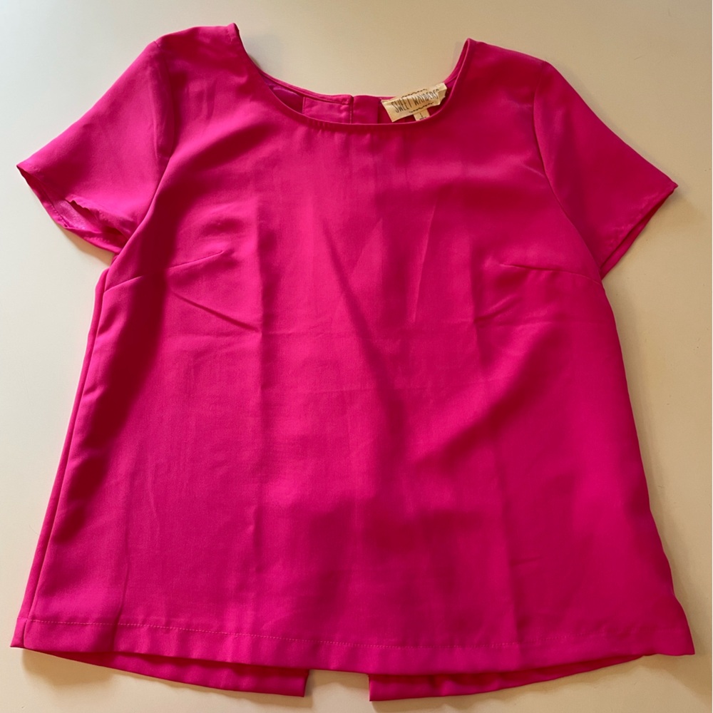 Pink top with cute button detail down the back